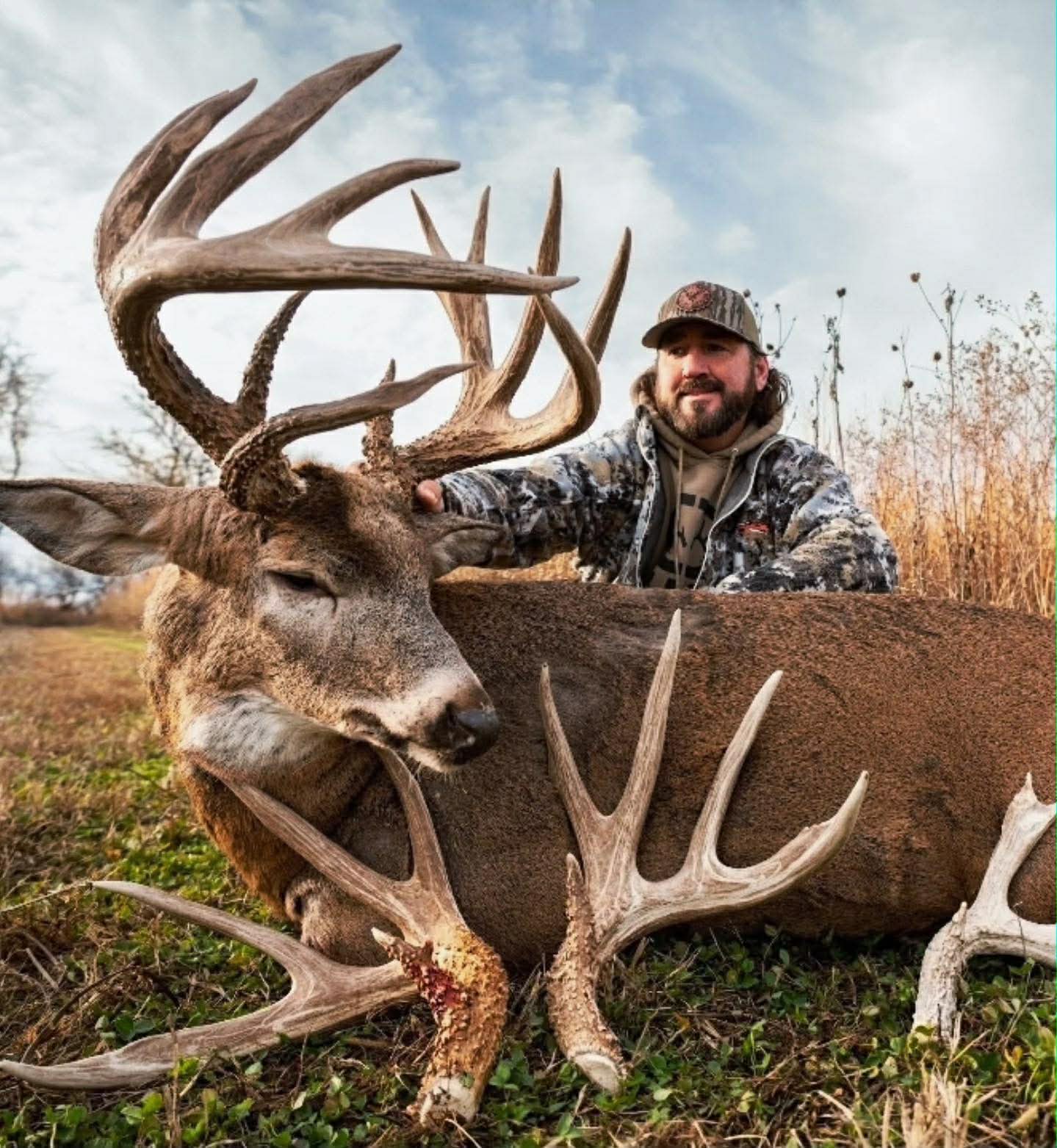 Hunter with a massive Nebraska whitetail buck